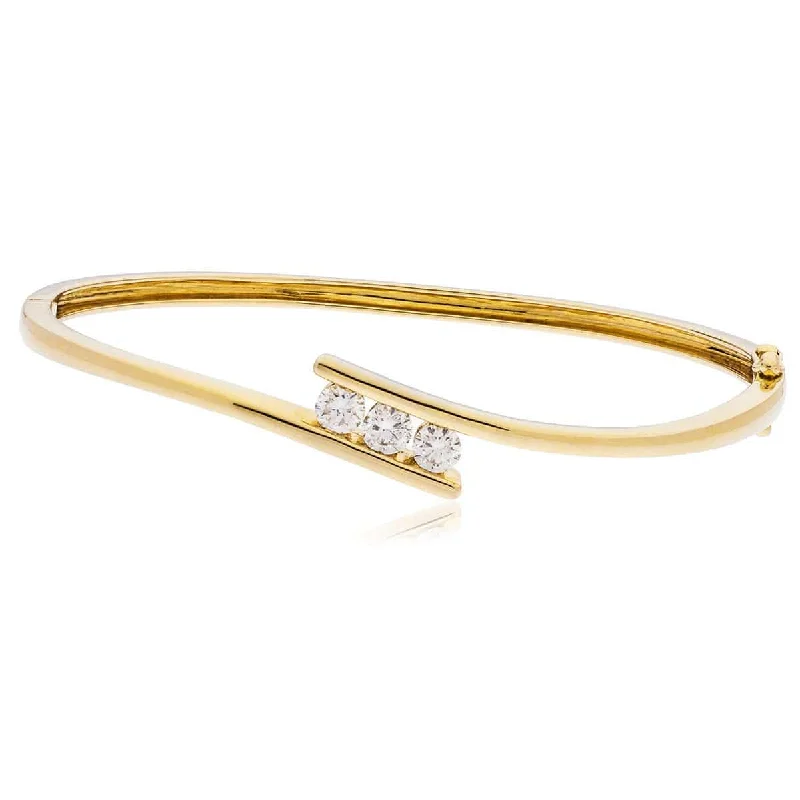 Women’s statement bracelets with diamonds-DIAMOND THREE STONE CROSS OVER BANGLE IN 18K YELLOW GOLD